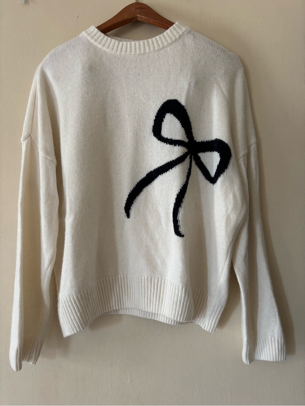 Cream Crewneck Sweater with Black Bow Motif